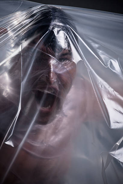 istock Man wrapped in plastic film. 183053871