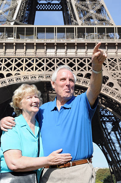 istock Senior couple in front of Eiffel Tower 183054390