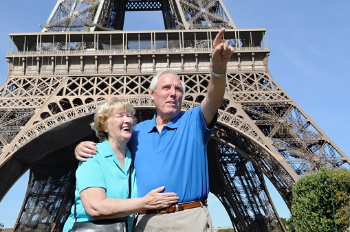 Senior couple enjoying their vacation in front of Eiffel Tower in Paris.Here are different images: