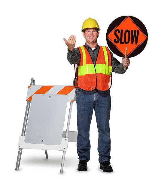 istock Road construction worker holding slow sign on white background 183054671