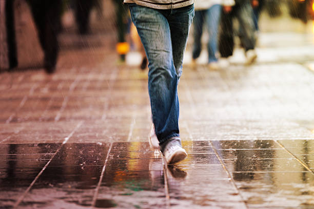 istock Pedestrian on zebra crossing in rain 183054988