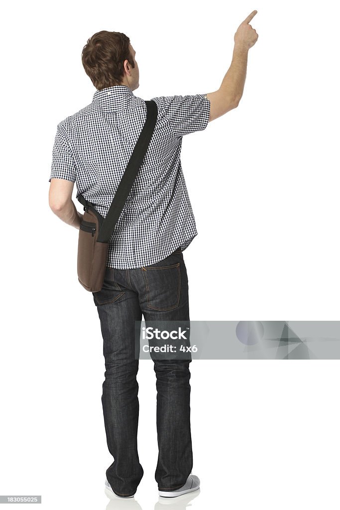 Vista traseira de um homem apontando com o dedo indicador - Royalty-free Vista Traseira Foto de stock