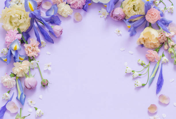 istock beautiful spring flowers on paper background 1830555622