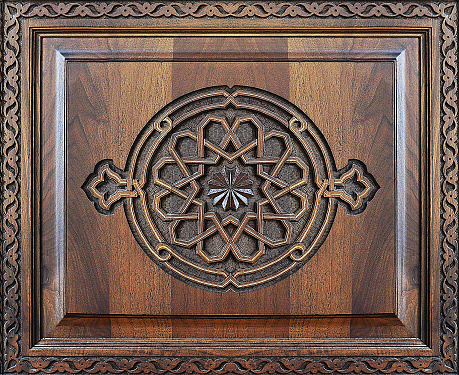 Beautiful Arabic patterns carved from wood on the door. Oriental architectural design.