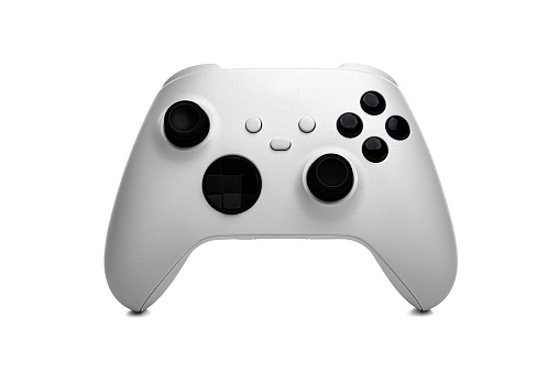 White wireless gamepad controller joystick isolated on a white background.