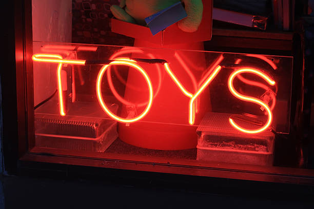 Neon Toy Sign Toy store window with neon sign. toy store stock pictures, royalty-free photos & images
