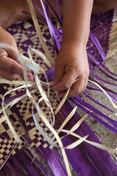 Weaving a Samoan mat