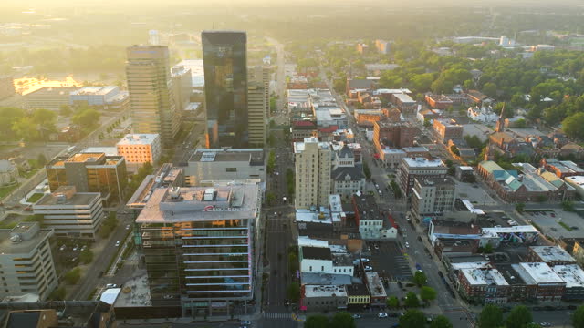 Lexington city in state of Kentucky with high office buildings in downtown district at sunset. American skyline with business financial district.