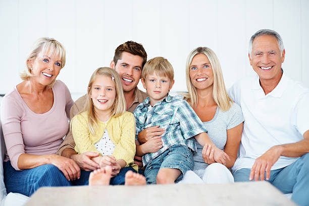 istock Relaxed multi generational family smiling together 183056420