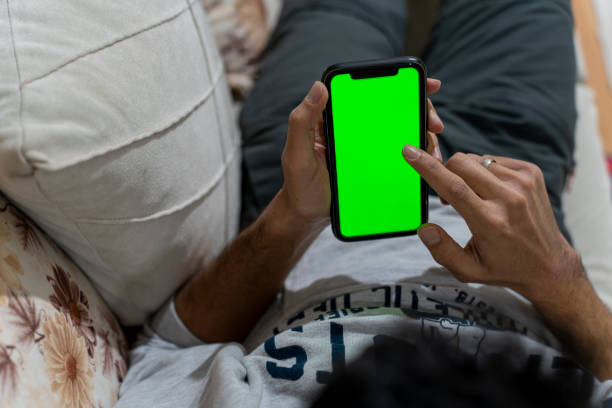 istock Male model holding a cell phone. 1830567357
