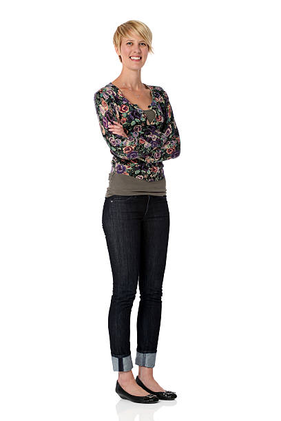 istock Happy woman standing with arms crossed 183057121