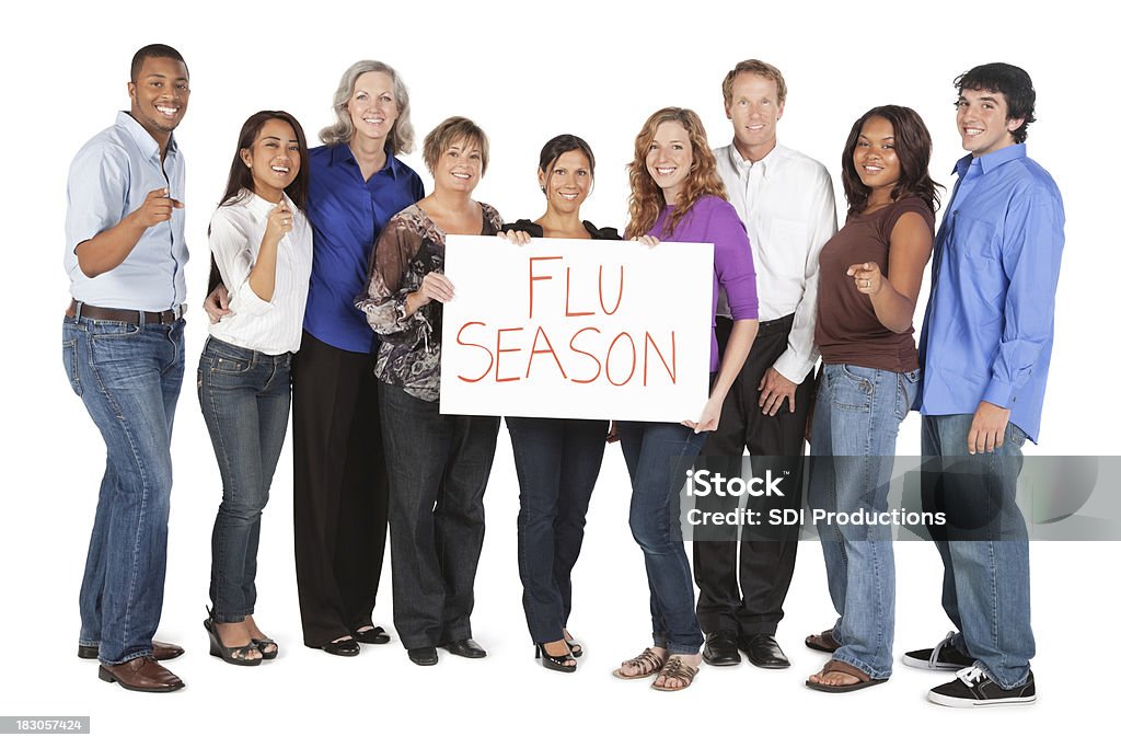 Feliz, diverso grupo de gente que sujeta la gripe señal de temporada - Foto de stock de Adulto libre de derechos