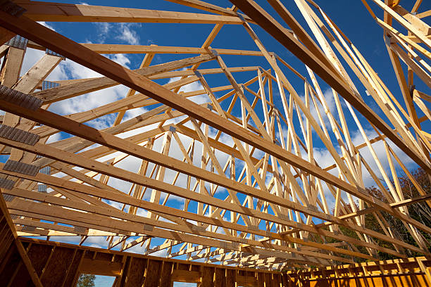 istock Home Building Construction Frame, Vast Trusses, Blue Sky 183057901