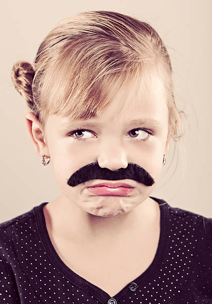istock 6 Year Old Girl with Moustache 183058250