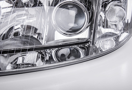 Car headlight isolated on a white background.