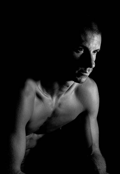 istock Naked man in the dark 183058302