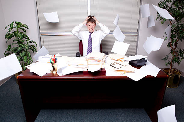 Stressed Business Man Thowing Paperwork stock photo