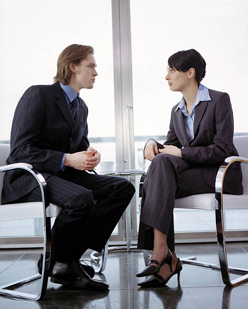 istock Business couple in interview scenario 183058937
