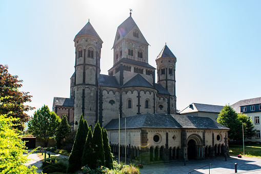 View at the bell towers and church of the Catholic Maria Laach Abbey near Glees in Germany. The abbey dates back to the year1100 and is now a monastery of the Benedictine Confederation.