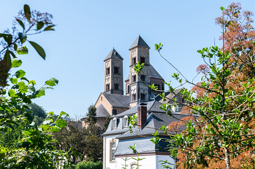 Riverside of Rhine in Basel dominated by majestic building of Munster church, Switzerland