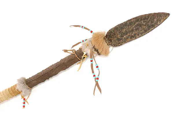 A close-up view of a decorative  primitive ceremonial spear.