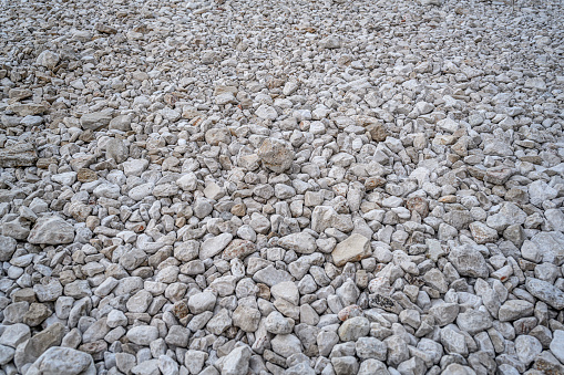 White pebbles on the beach as an abstract background.