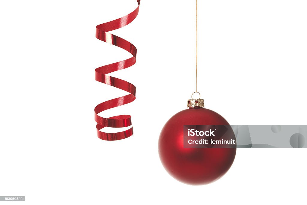 Red streamer and Christmas bauble Red christmas bauble and streamer isolated on white background. This is an exclusive image and it can only be found in iStockphoto. Red Stock Photo