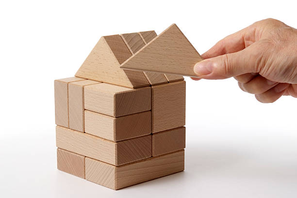 Wood block house made by hand isolated on white background.