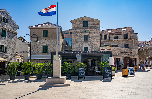 Primosten, Croatia - July 27, 2023: Restaurant with terrace in Primosten, old town architecture. Dalmatia, Croatia.