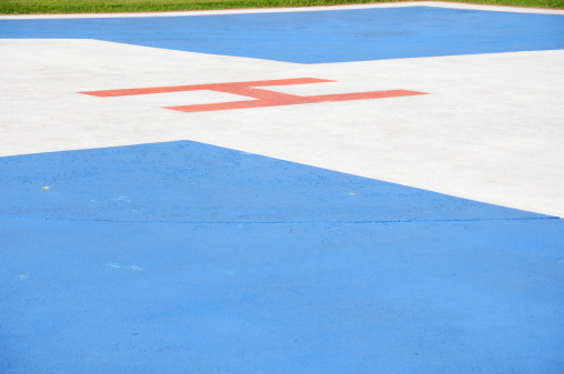 Large H on hospital helicopter landing pad