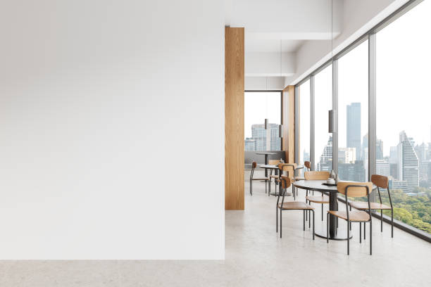 istock White and wooden cafe interior with blank wall 1830620024