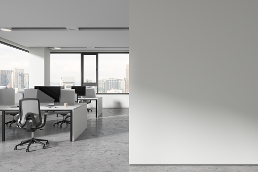 Minimalist office interior with chairs and pc computers in row, grey concrete floor. White workplace and panoramic window on Kuala Lumpur. Mock up copy space wall partition. 3D rendering