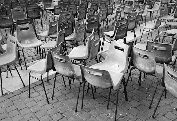 istock abandoned chairs after street performance 183062080