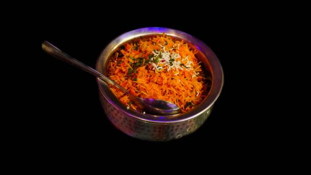 istock veg biryani on aluminium bowl with black background 1830622257