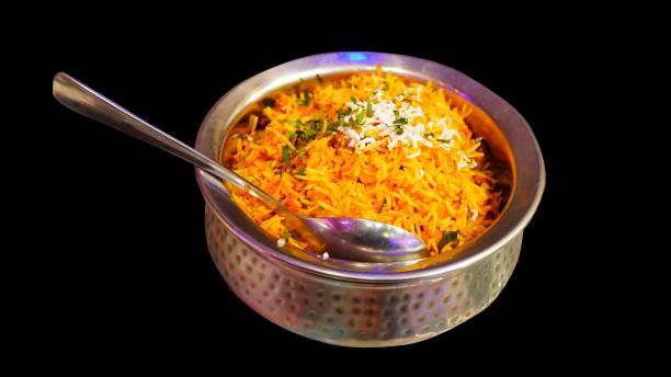 istock veg biryani on aluminium bowl and spoon with black background 1830622779