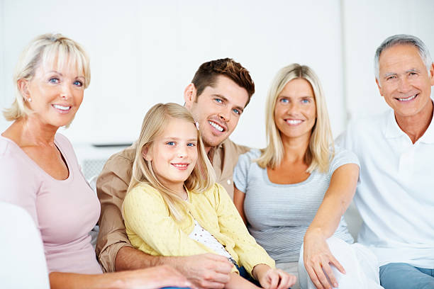 istock Smiling three generational family sitting together 183062365