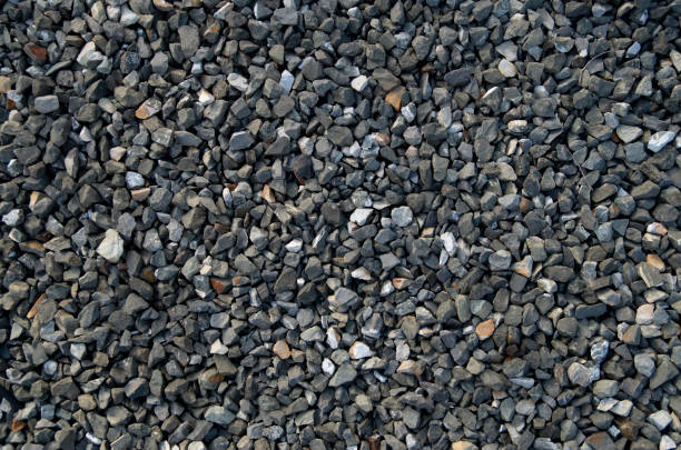 istock Small black gravel on road closeup 1830627799
