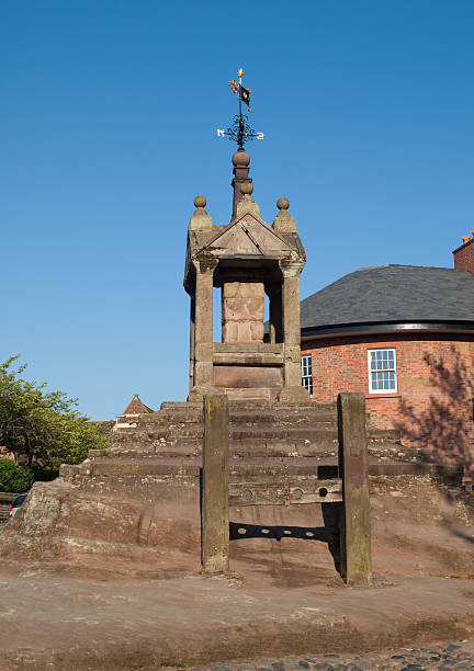 istock Lymm cross and stocks Cheshire 183063098