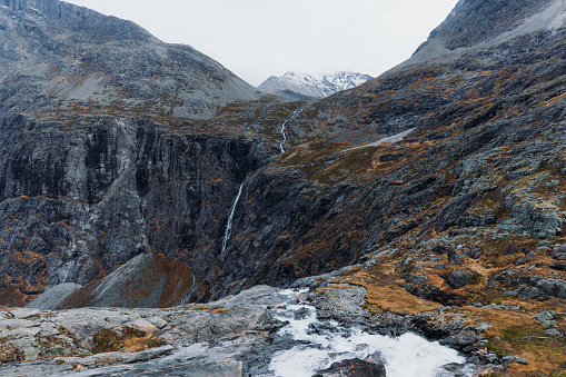 Dramatic view of powerful waterfall with scenic view of the mountains in Western Norway, Scandinavia