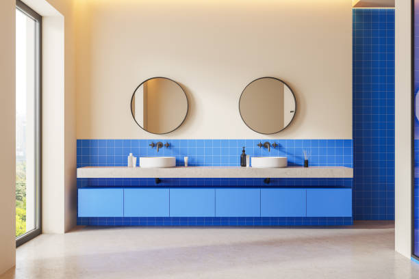 istock Stylish home bathroom interior with double sink and panoramic window 1830634591