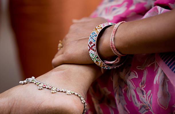istock Indian woman with silver anklets and bracelets 183063592