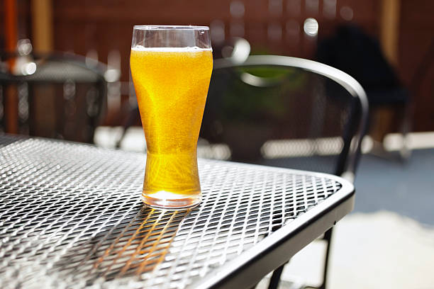 istock Bar Beer Glass on an Outside Pub Patio Table 183064447