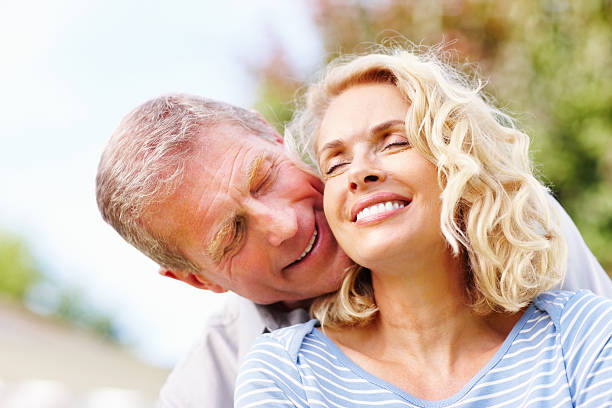 close-up of a romantic mature couple - ogen dicht closeup vrouw 50 jaar stockfoto's en -beelden