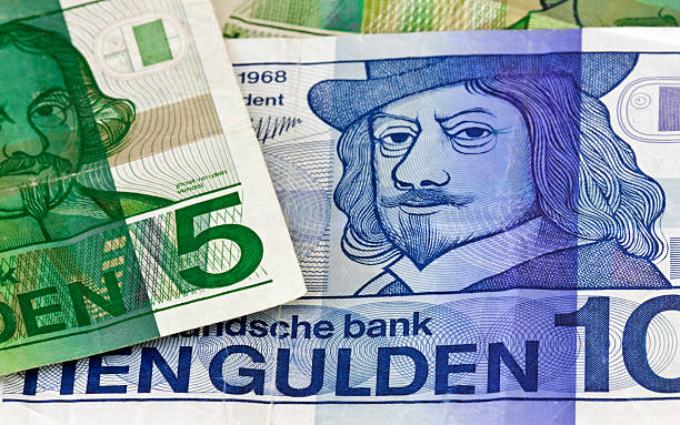 Dutch ten Guilder banknote close-up Close-up of a Dutch ten Guilder banknote between five Guilder notes. These notes were used before the Euro was introduced as the European currency. dutch guilders stock pictures, royalty-free photos & images