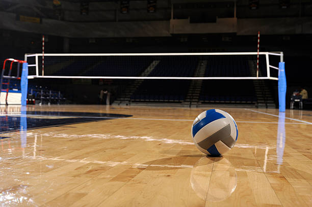 Volleyball in an empty gym stock photo