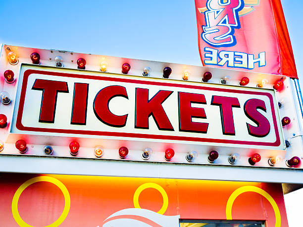 istock Carnival Tickets Booth Sign at a County Fair Amusement Park 183064717
