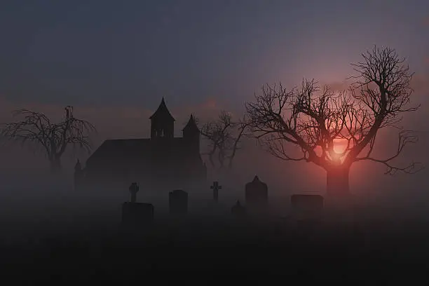 Photo of An old church graveyard in the fog