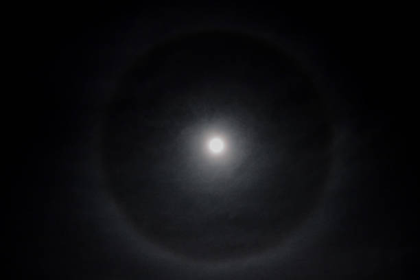 istock Full moon in a cloudy sky with halo 1830652954
