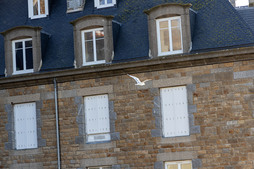 Old building with chimney in Saint-Malo , France