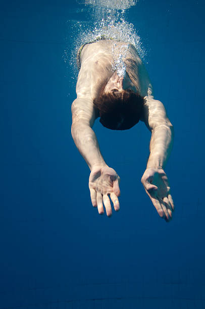 istock Young man upside down in the water 183065861